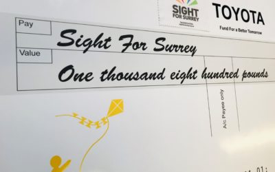 Sight for Surrey receives cheque from Toyota GB