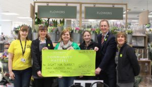 Waitrose Dorking presents cheque to Sight for Surrey