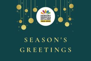 Season's Greetings on a dark green background with gold baubles hanging down from the top of the card with Sight for Surrey logo featured top centre of the card.