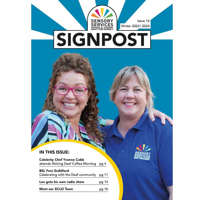 Signpost Winter 2023/24 front cover shows Deaf celebrity chef Yvonne Cobb with Emma Burton, from the charity. Yvonne has her arm around Emma's shoulders and both have beaming smiles.