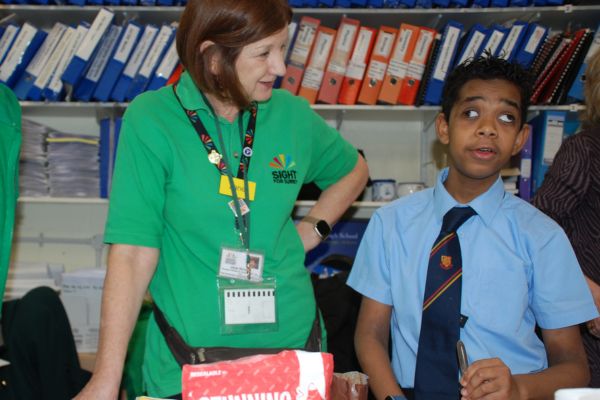 Head of CYPS with a young person we support, overseeing Habilitation cooking skills at the Braille Challenge regional heats