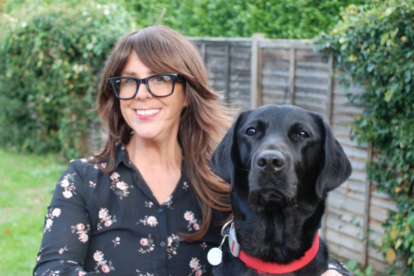 Clare Burgess and Albert 600 x 400 (1) Clare Burgess with her assistance dog Albert