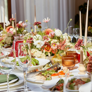 A table laden with food and drinks, set out formally.
