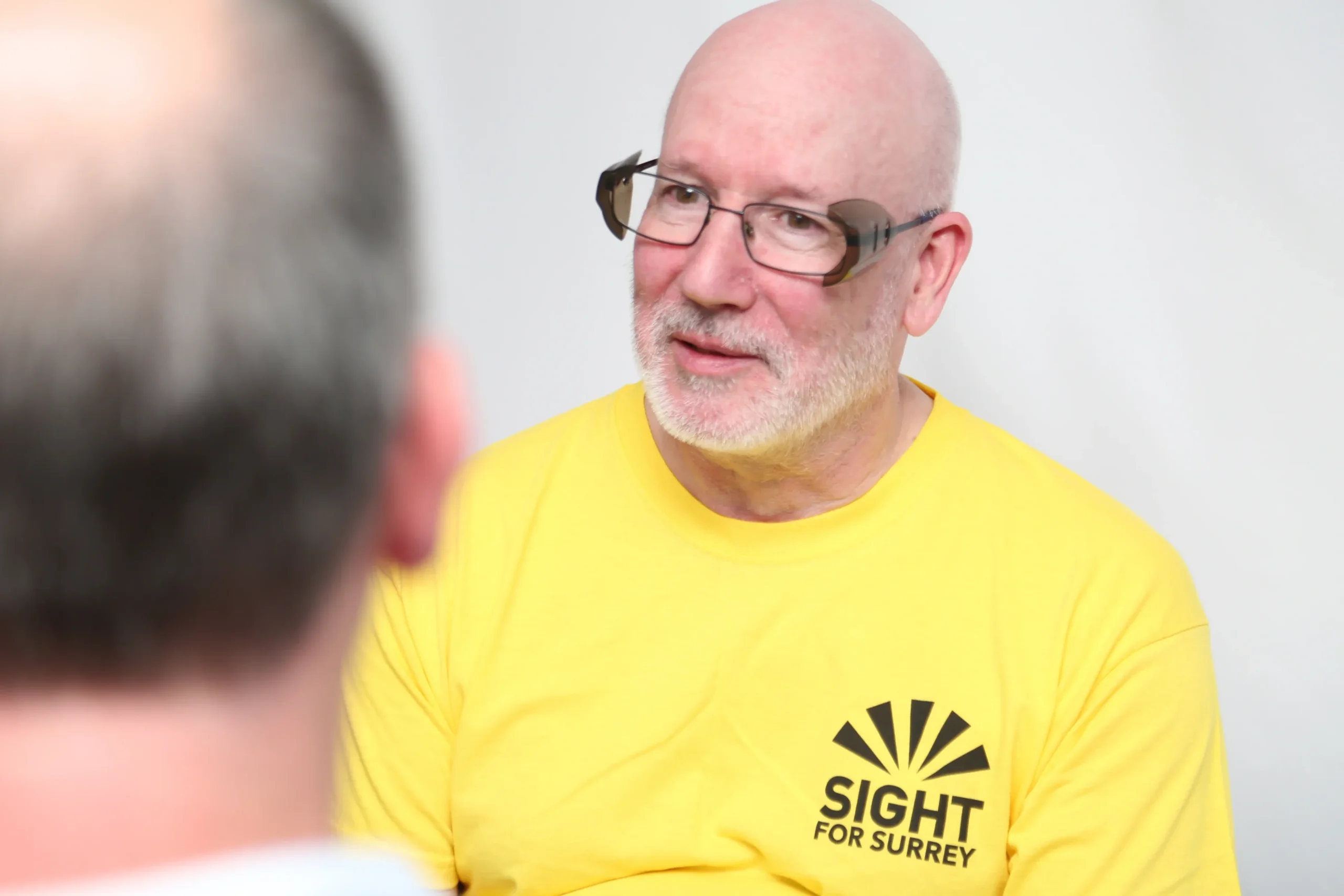 John volunteer and fundraiser talking to a person