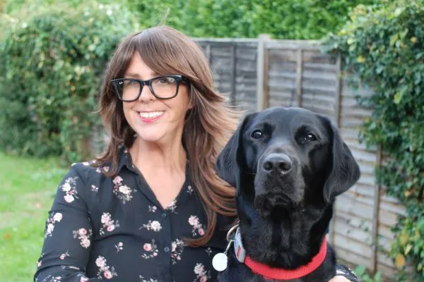 Clare Burgess, CEO with Albert, her assistance dog.