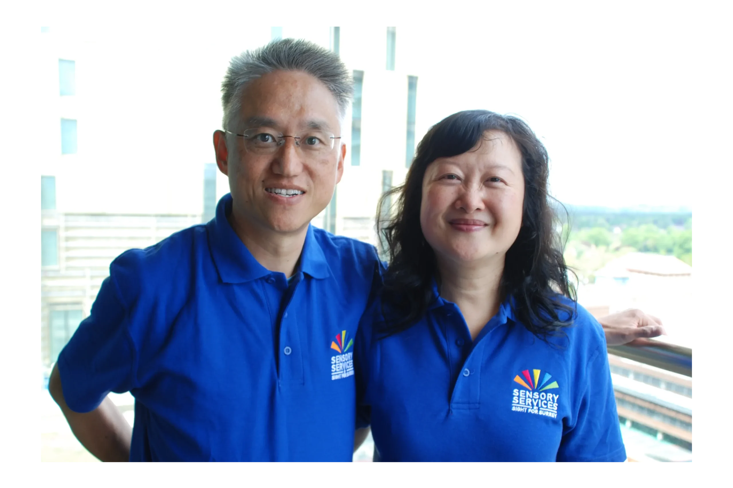 Two volunteers standing side by side.