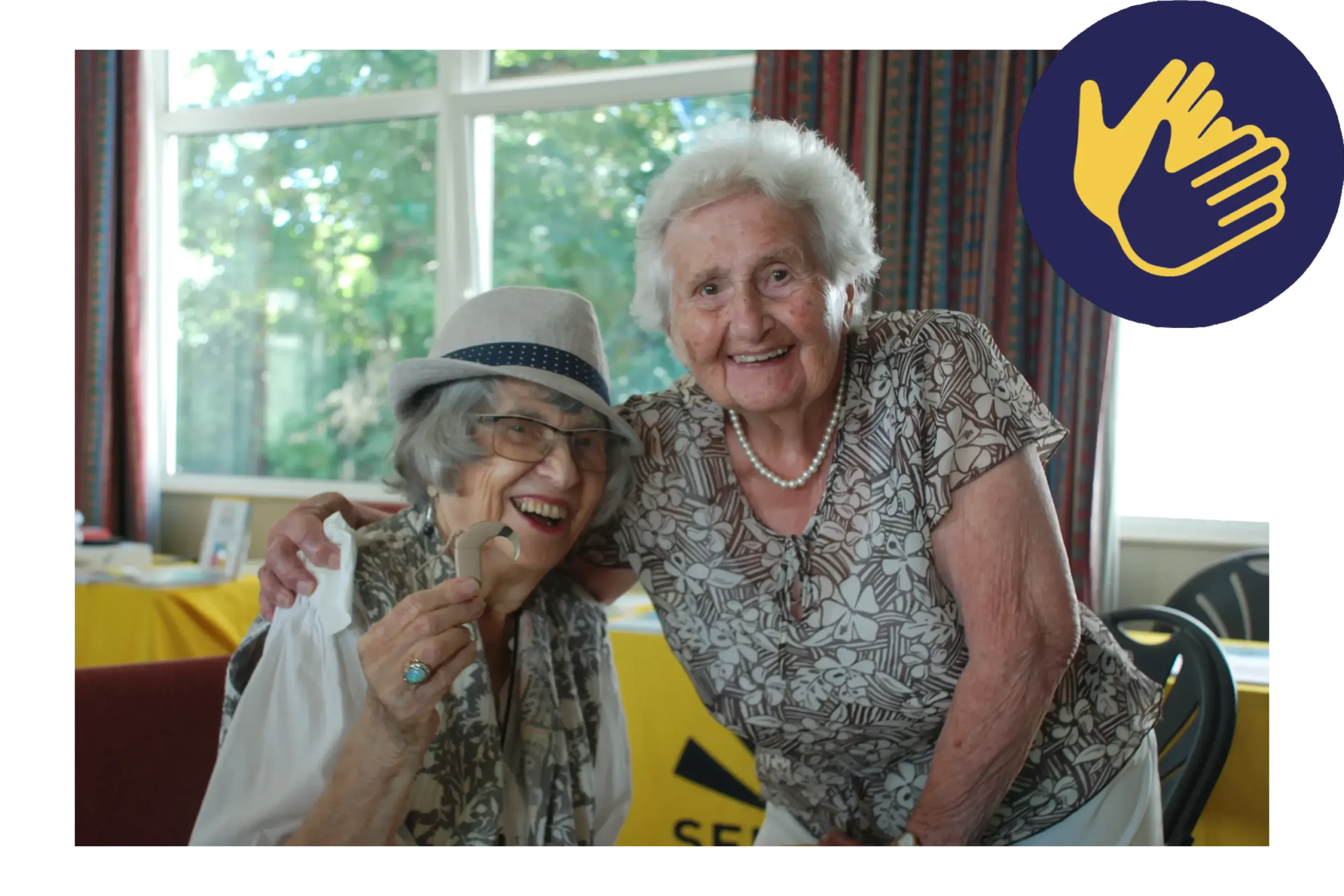 Two elderly ladies at one of the charity's events.