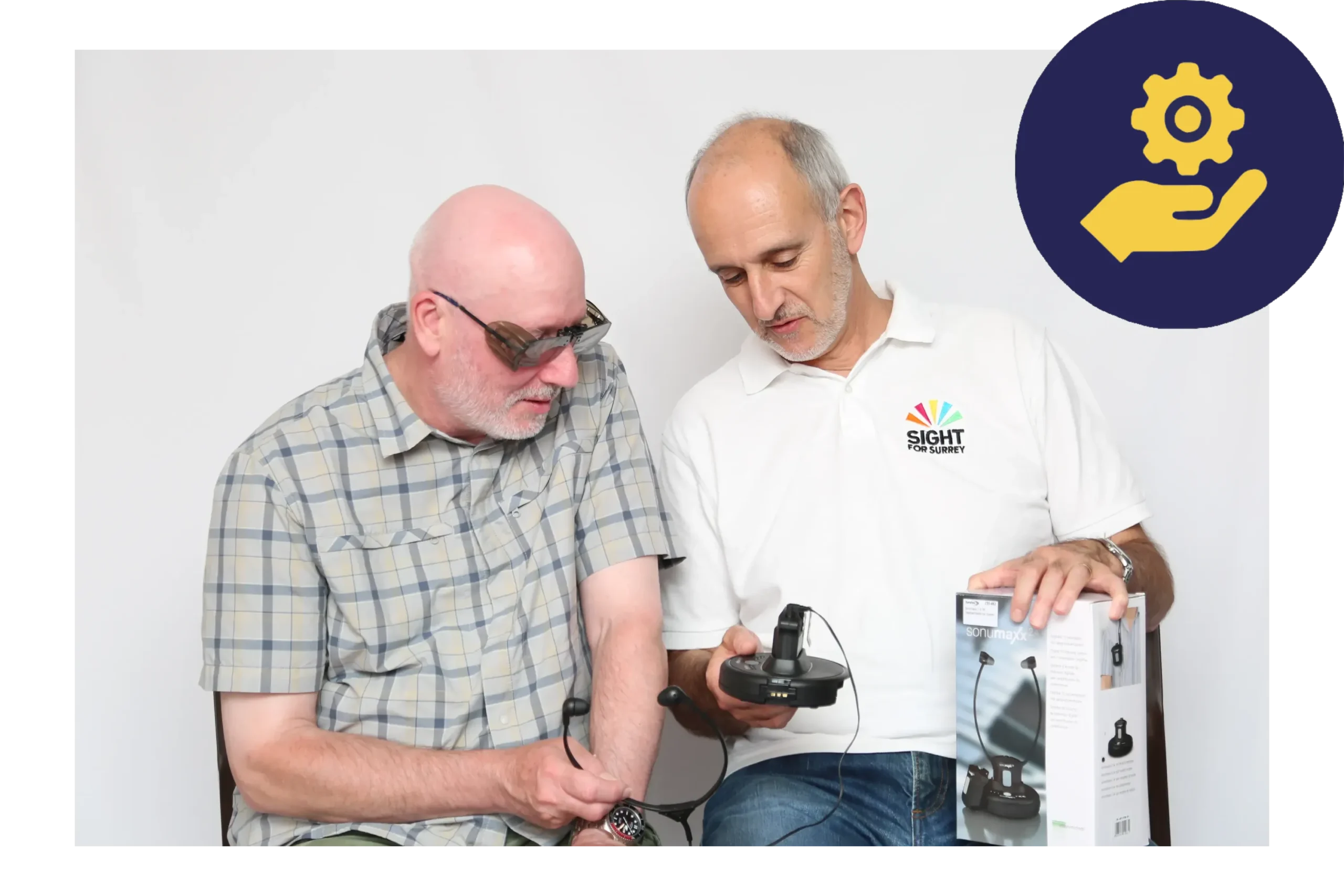 A man showing hearing loss equipment.