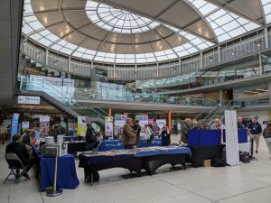 People visiting exhibition stands at a Vision Zone event