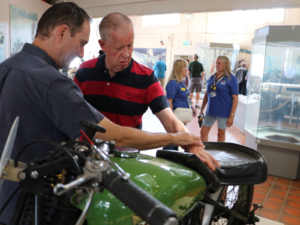 Russell touching a vehicle at Brooklands