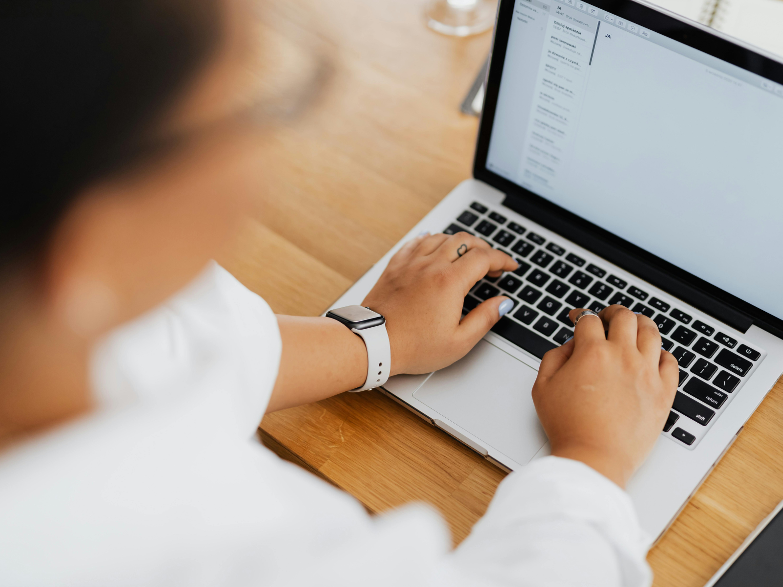A person using a laptop downloading tutorials